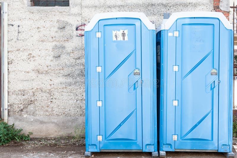 Two blue portable toilet. stock photo. Image of latrine 55431026