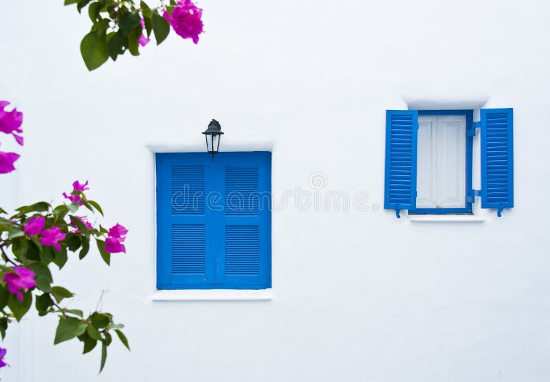 Two blue windows on white wall building in modern decoration