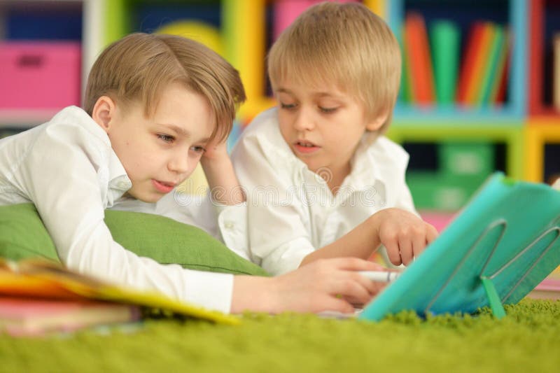 Two bored boys doing homework