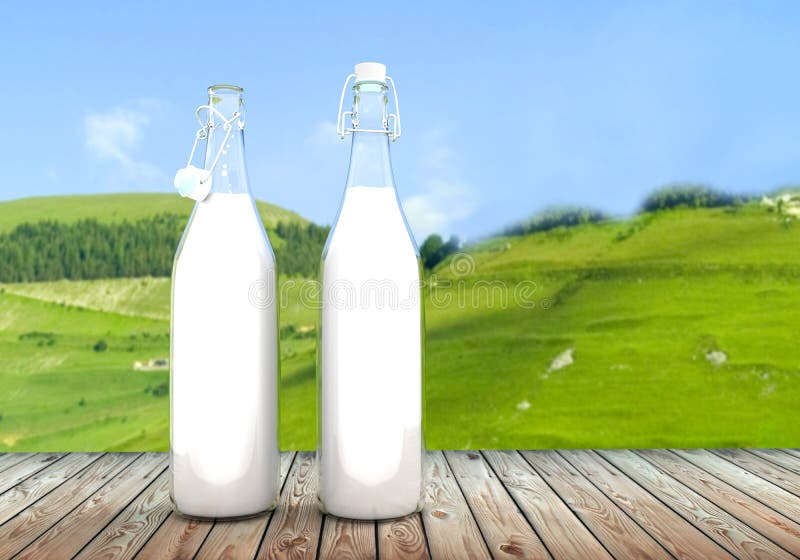 Two bottle of milk on wooden table