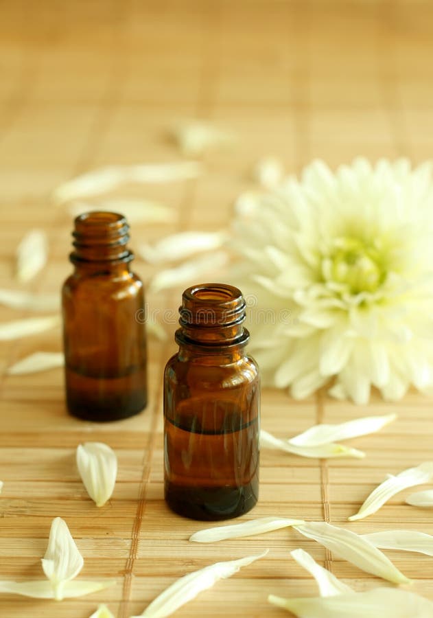 Two bottles of essence oil and chrysanthemum.