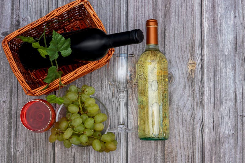 Two Bottles of Wine with Tap and White Wine and Two Glasses on a Thin Stem Stock Photo Image