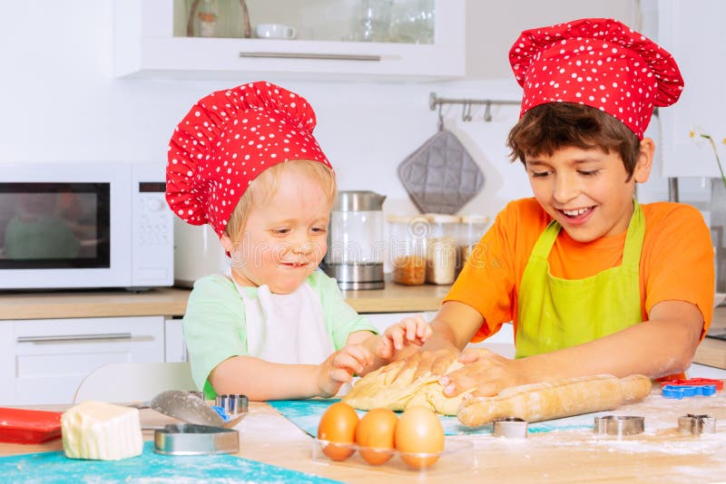 Two Boys Crumble Dough Using Hands in Chef Hats Stock Image Image of smile, bakery 232506041