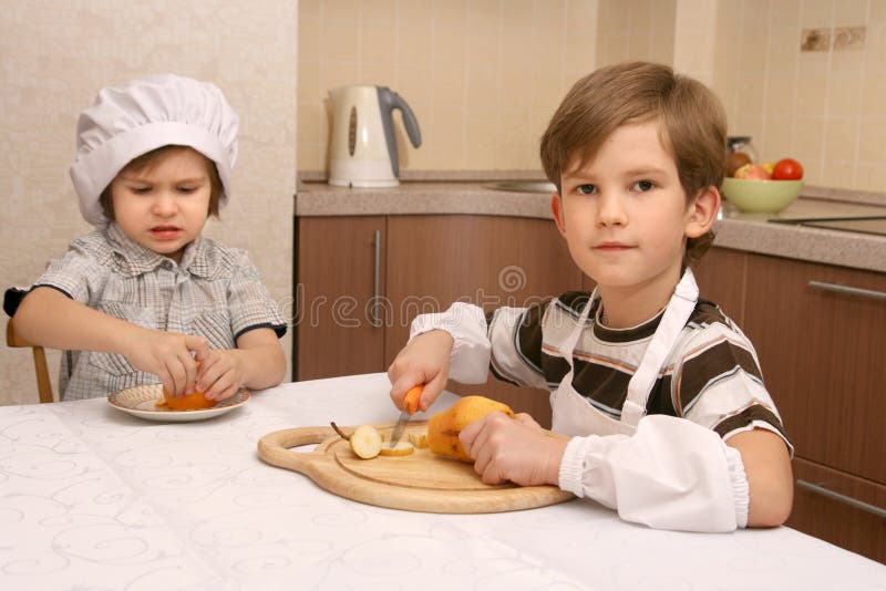Two boys in kitchen stock photo. Image of table, kettle 29402656