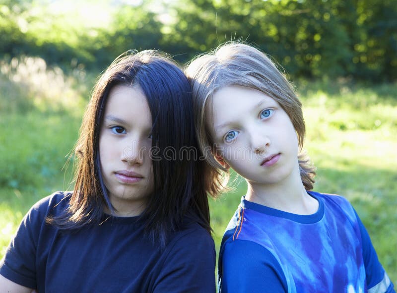 Two Boys with Long Hair in the Garden Stock Image - Image of look, face:  129545913