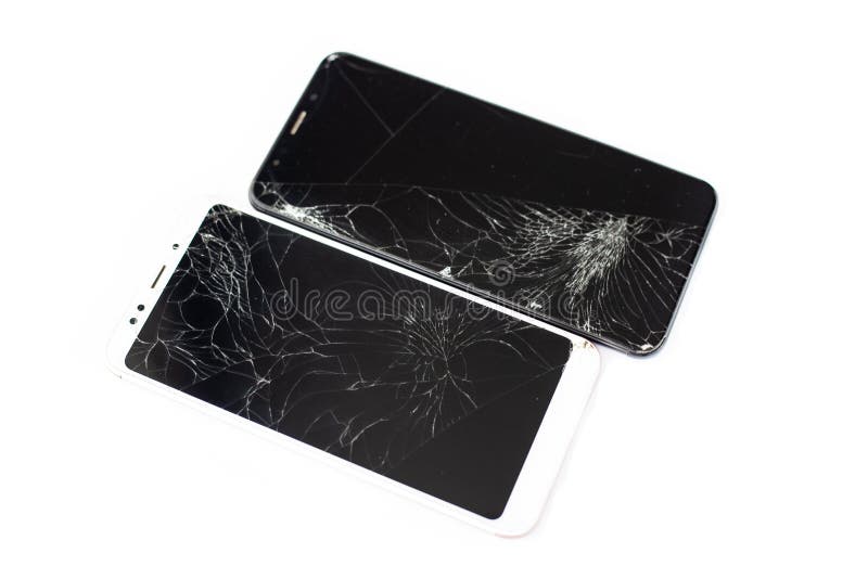 Two broken phones of white and black on a white background. cracked touchscreen glass of the touch screen isolate