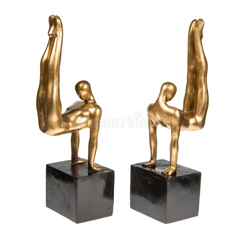Bronze Statues of Figures of Acrobats on a White Background Stock Image