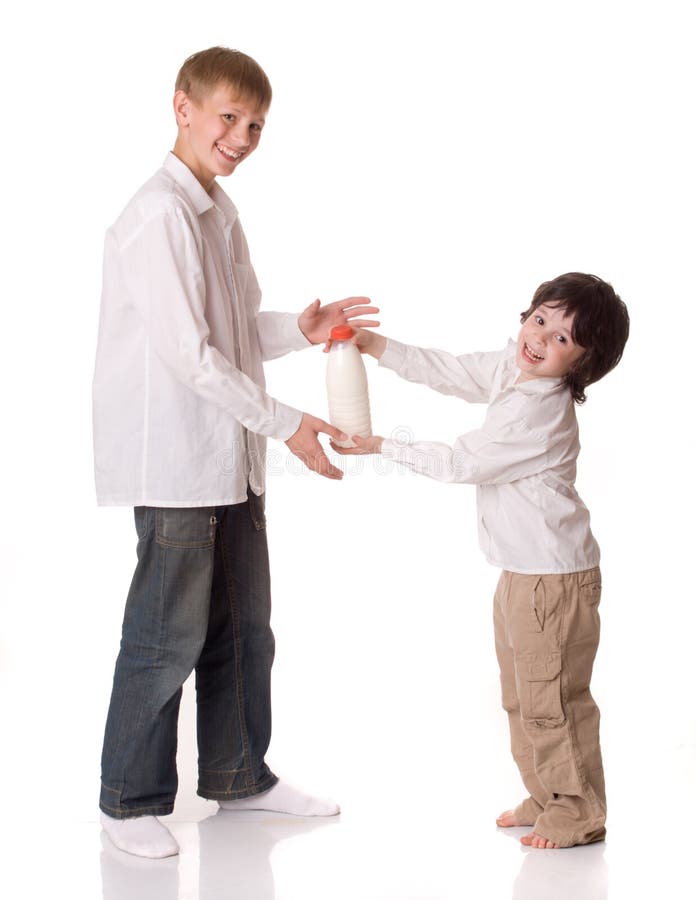 Two brothers with a bottle of milk