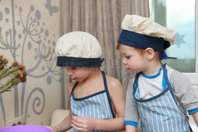 Two Brothers Cooking in Kitchen Stock Photo Image of indoor, meal