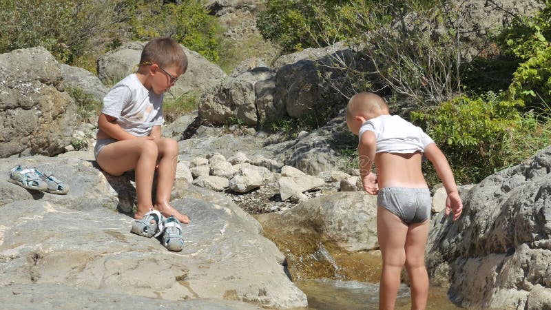 Two Brothers, Little Boys Walk Barefoot on the Mountain Stream. Stock Footage - Video of stones, legs: 88700782