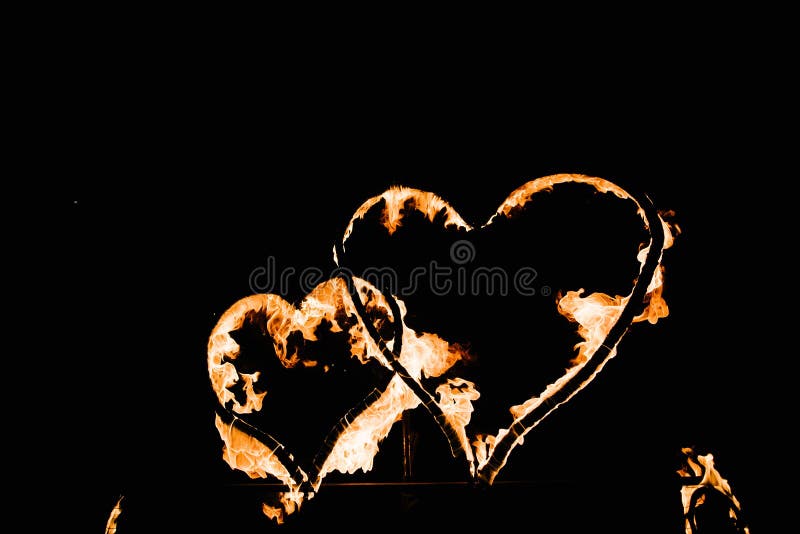 Two burning hearts on a dark background close up. Glowing hearts in the dark, shape, black, valentine, energy, day, passion, abstract, love, flame, object, light, orange, nobody, fiery, sign, symbol, fire, yellow, bright, hot, design, sparks, flaming, heat, frame, photo, one, emotion, red, bonfire. Two burning hearts on a dark background close up. Glowing hearts in the dark, shape, black, valentine, energy, day, passion, abstract, love, flame, object, light, orange, nobody, fiery, sign, symbol, fire, yellow, bright, hot, design, sparks, flaming, heat, frame, photo, one, emotion, red, bonfire