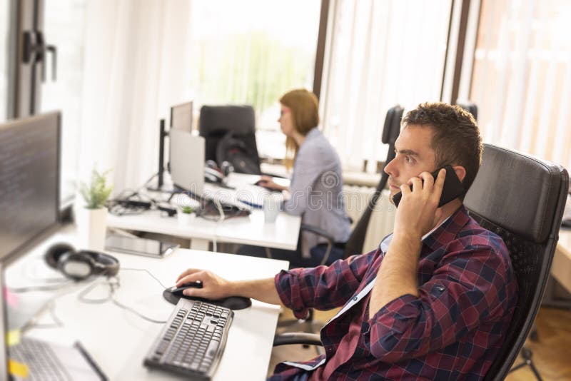 Making a phone call at work royalty free stock photo