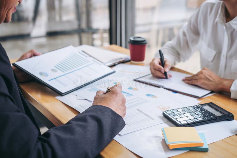 Two business team discussing and planning strategy company growth project success financial statistics, Partner meeting royalty free stock photography
