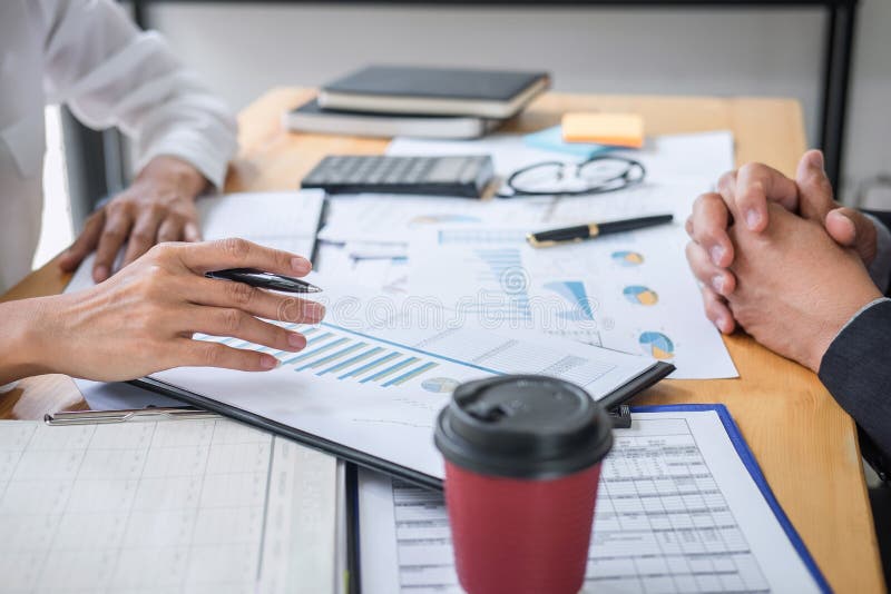 Two business team discussing and planning strategy company growth project success financial statistics, Partner meeting stock photography