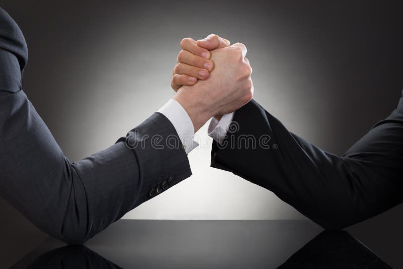 Close-up Of A Two Businessman Competing In Arm Wrestling. Male hand holding businessman stock images, royalty-free photos and pictures