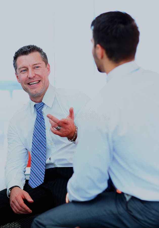 Two businessmen discussing stock image. Image of conversation - 23642309