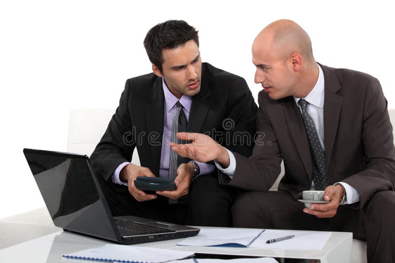 Two businessmen preparing proposal stock photos Two businessmen preparing proposal stock photos
