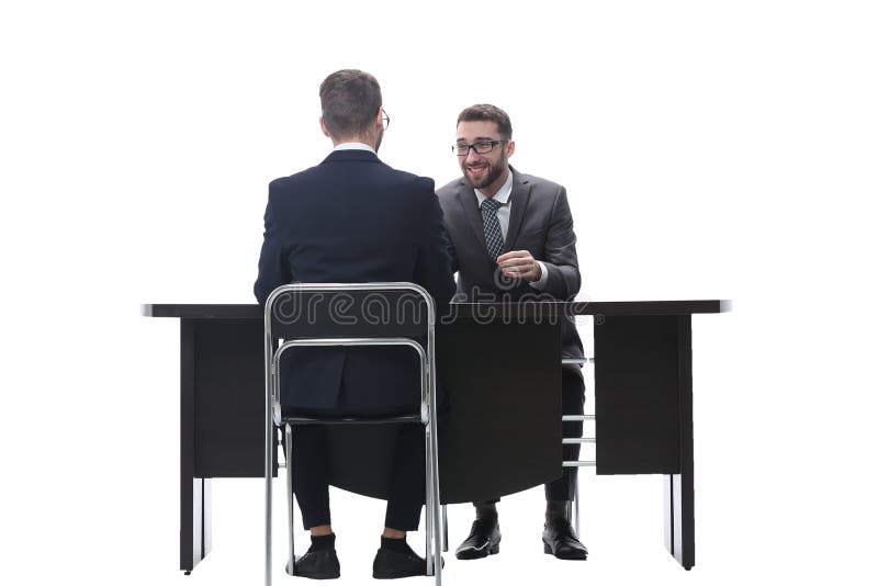 Two Businessmen Talking, Sitting at His Desk Stock Photo Image of