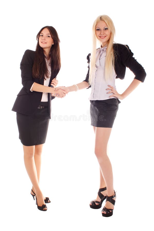 Two businesswoman shake hands