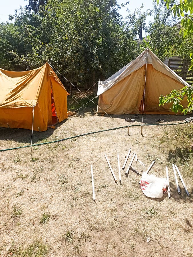 Two Camping Tents and Camping Gear in Spring Green Forest Stock Photo Image of cottage, grass