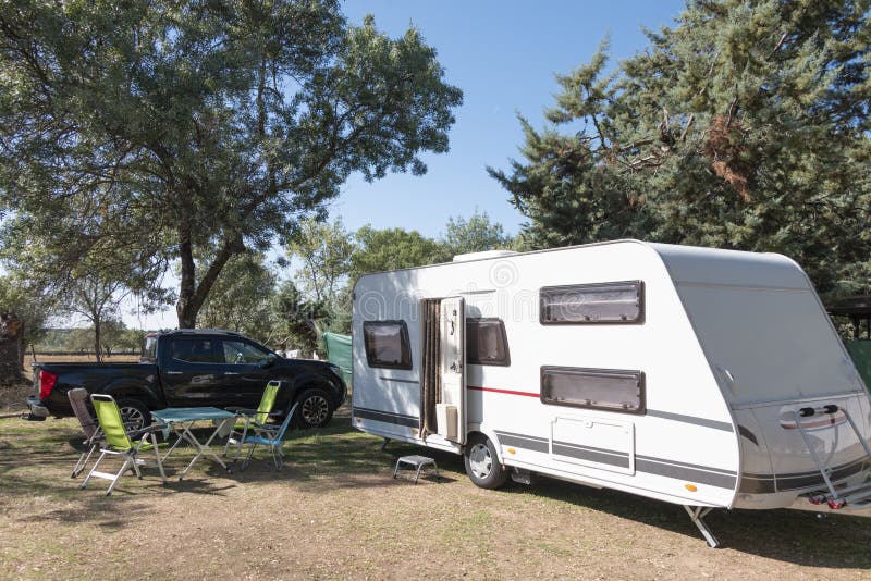 Two Caucasian Children Play and Spend Alternative Holidays in a Caravan
