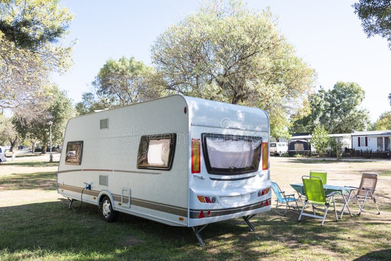 Two Caucasian Children Play and Spend Alternative Holidays in a Caravan