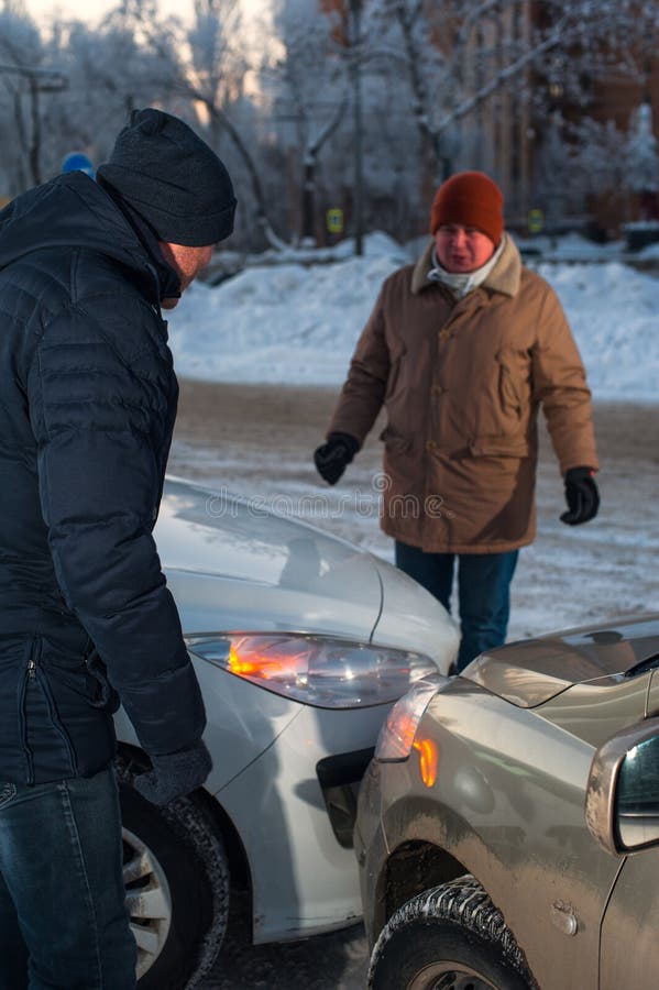 Two caucasian drivers arguing after car crash royalty free stock images
