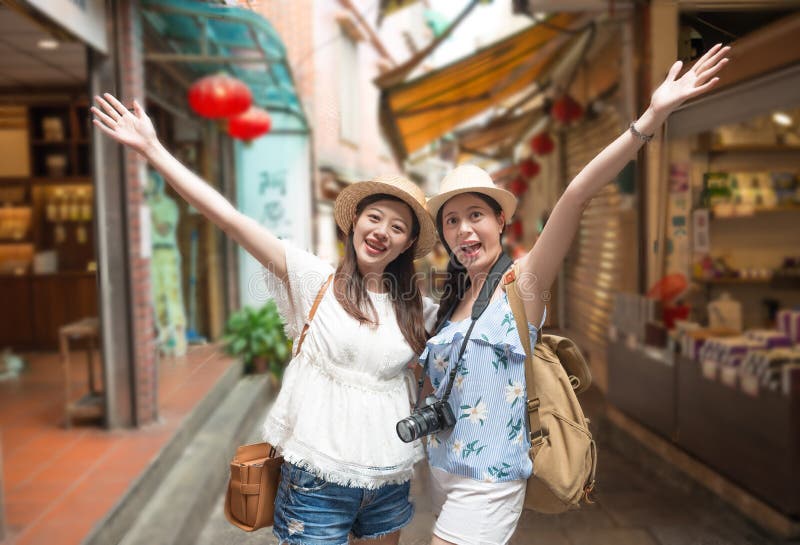 Girls happy visiting Jiufen town of Taiwan.