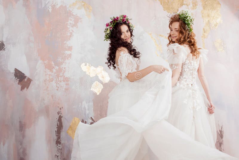 Two Charming Brides in Beautiful Spring Wreaths on Their Heads ...