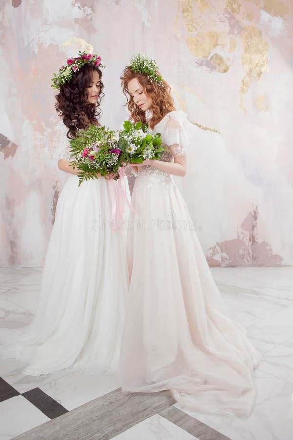 Two Charming Brides in Beautiful Spring Wreaths on Their Heads ...