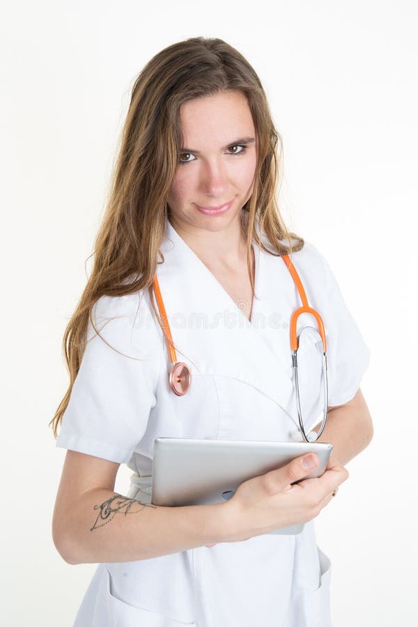 Two cheerful doctors using a digital tablet. Isolated on white royalty free stock photography Two cheerful doctors using a digital tablet. Isolated on white royalty free stock photography