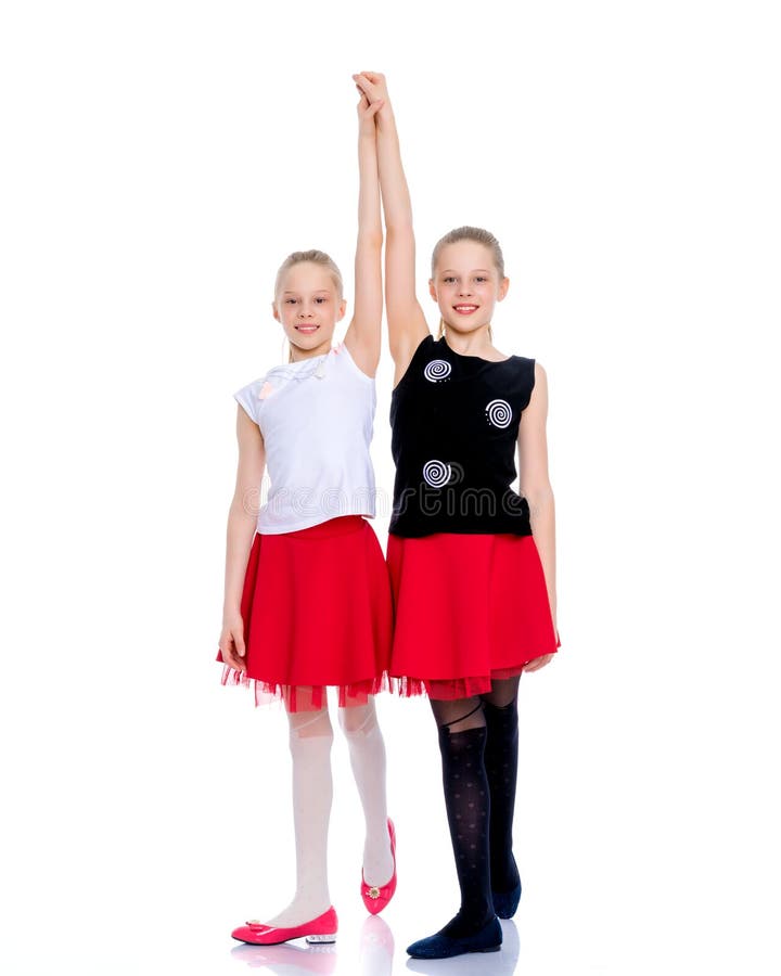 Two cheerful little girls are dancing. stock photography Two cheerful little girls are dancing. stock photography