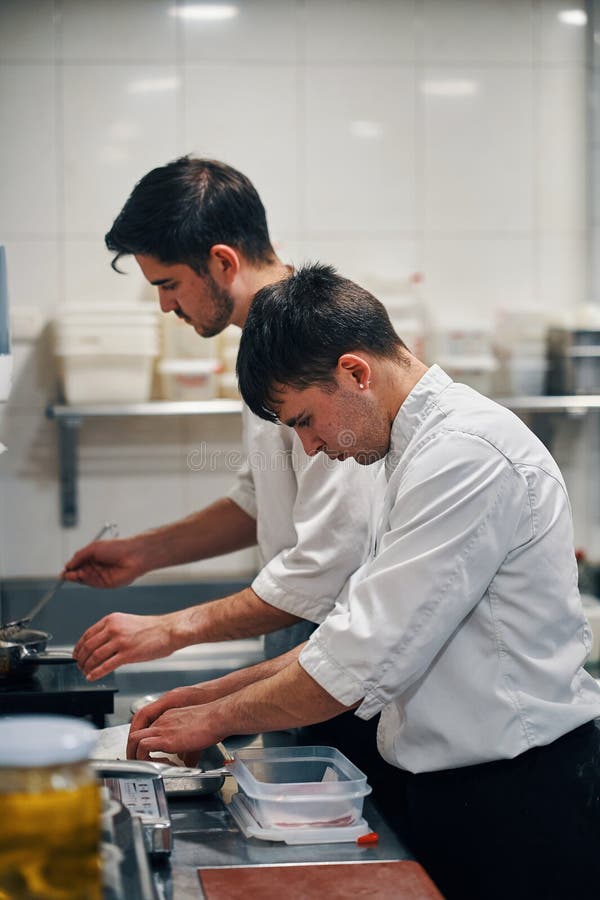 Two Chefs Working in Professional Kitchen Stock Image Image of