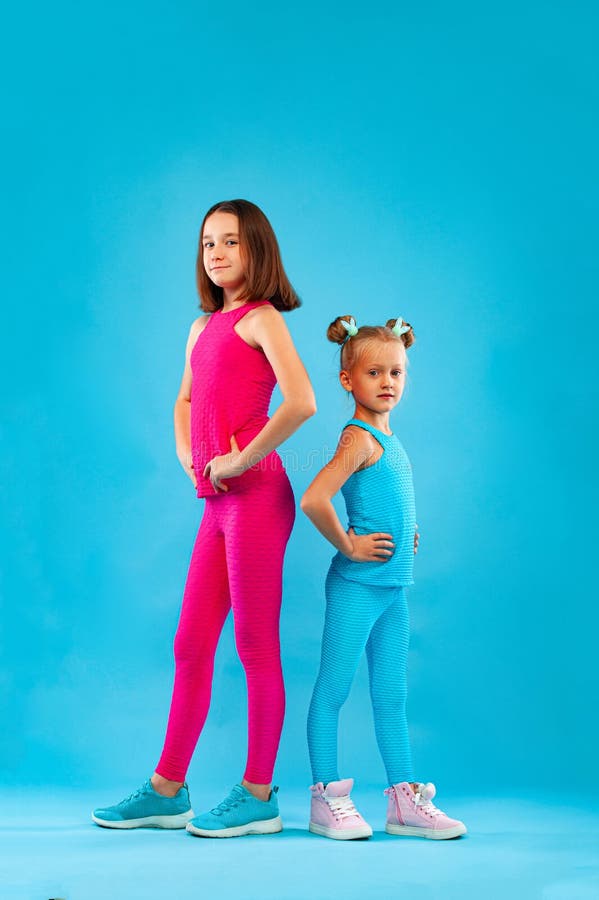 Two Children Girls Listen To Music on a Pink Background. Kids Lifestyle ...