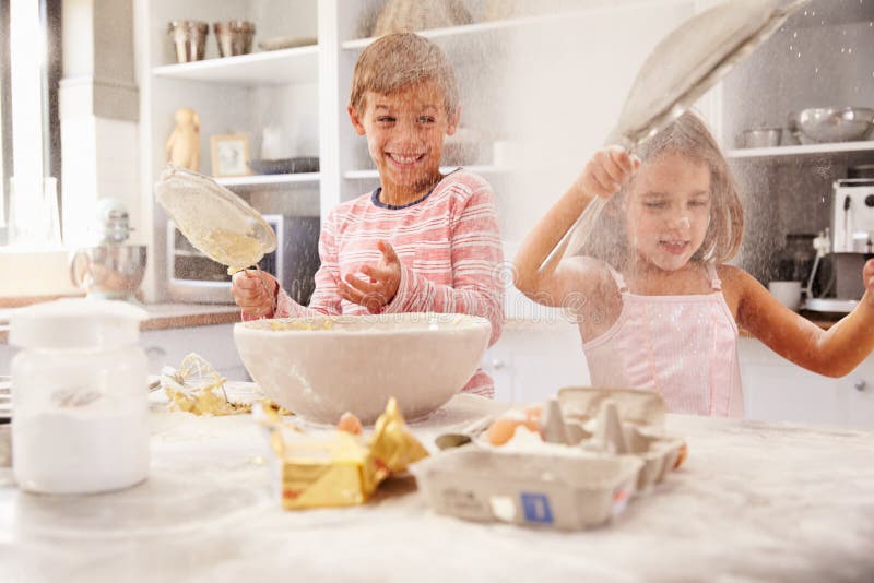 Two Children Having Fun Baking in the Kitchen Stock Image Image of