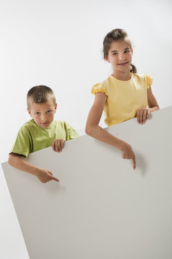 Two Teen Girls Holding Large Blank Poster Board Over White. Stock Photo,  Picture and Royalty Free Image. Image 2010459.