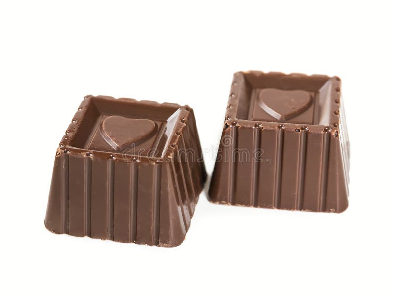 Two Delicious Dark Chocolate Candies Isolated On A White Background