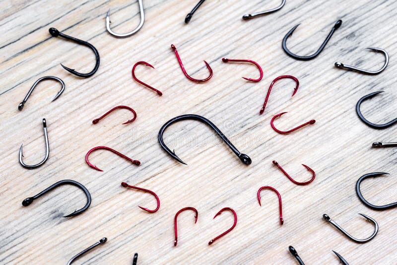 Two Circles of Fishing Hooks Surround One Big Fishing Hook One Circle of  Red Hooks Stock Image - Image of catching, acute: 142377735