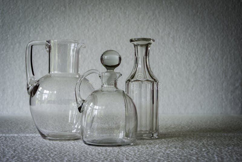 https://thumbs.dreamstime.com/b/two-clear-glass-pitchers-bottle-one-stopper-side-view-shadow-across-white-background-95696052.jpg