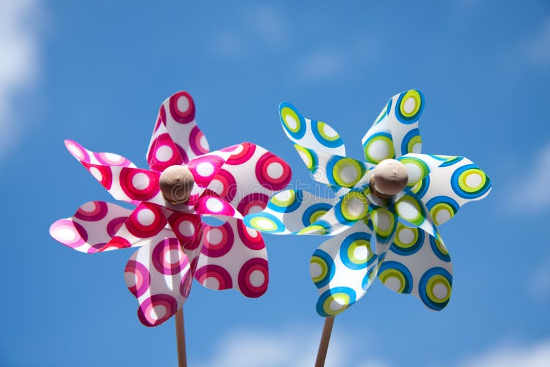 Two colorful windmill toys