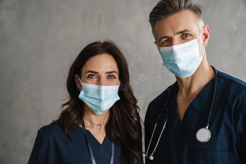 Two Confident Doctors in Medical Masks Standing Stock Image Image of