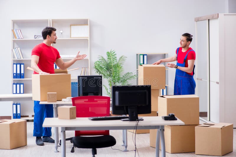 The two contractor employees moving personal belongings stock photography The two contractor employees moving personal belongings stock photography