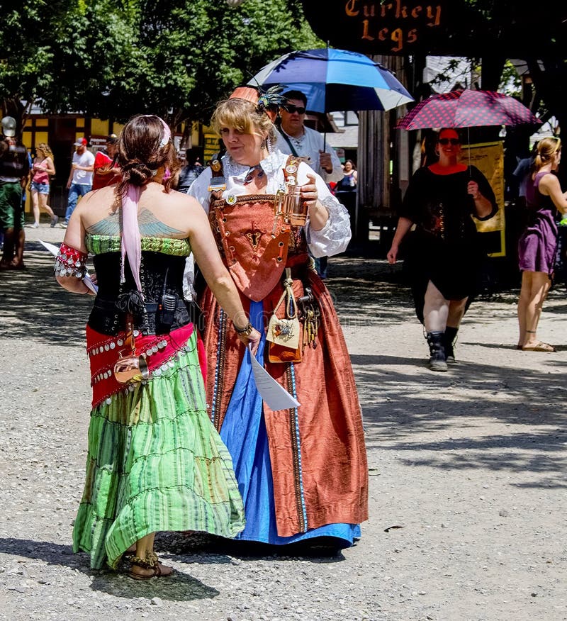Costumed women chatting at Renaissance Faire in Muskogee Oklahoma USA 5 28 2017 royalty free stock image Costumed women chatting at Renaissance Faire in Muskogee Oklahoma USA 5 28 2017 royalty free stock image