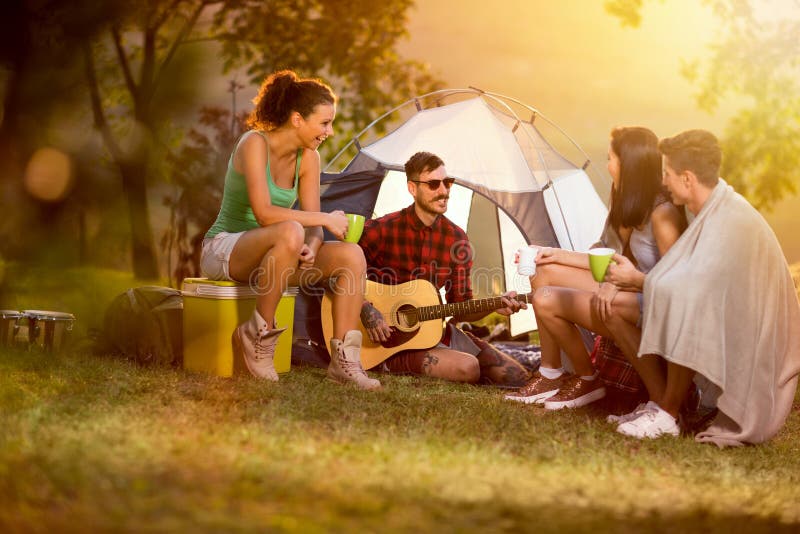 Two couples camping together stock images Two couples camping together stock images