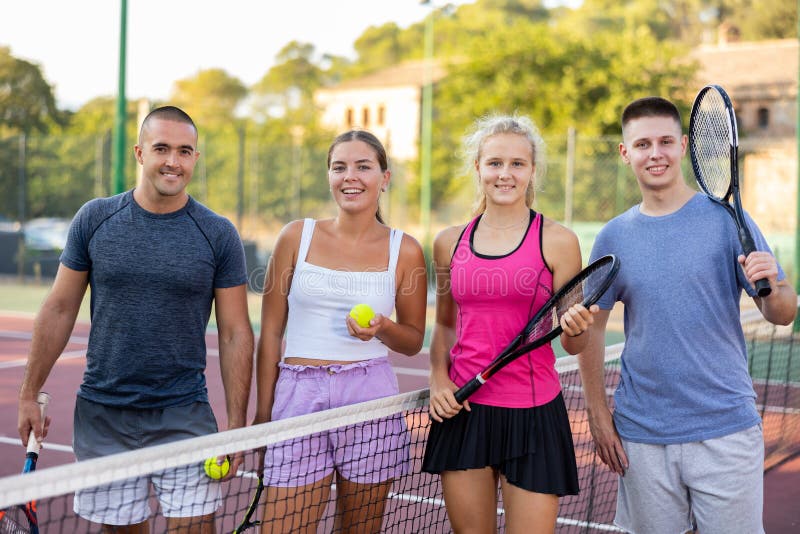 Two Couples of Young People Talking after Tennis Match Stock Image ...