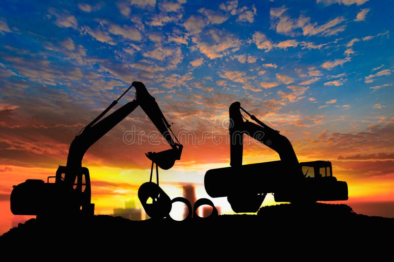 Two Crawler Excavator silhouette is digging soil in construction site with pipeline work on sunset backgrounds. Track hoe construction excavator stock images, royalty-free photos and pictures