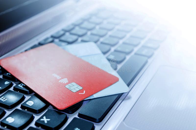 Two credit cards standing on laptop keyboard business computer ecommerce electronic finance internet online payment security sell shopping technology transaction. Keyboard sell stock images, royalty-free photos and pictures