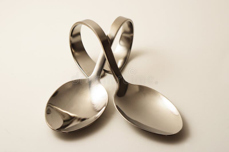 Two crossed party spoons