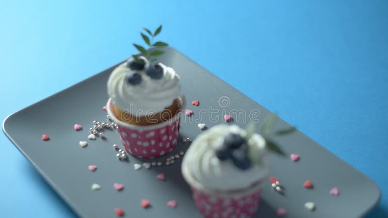 Two cupcakes on a rectangular plate