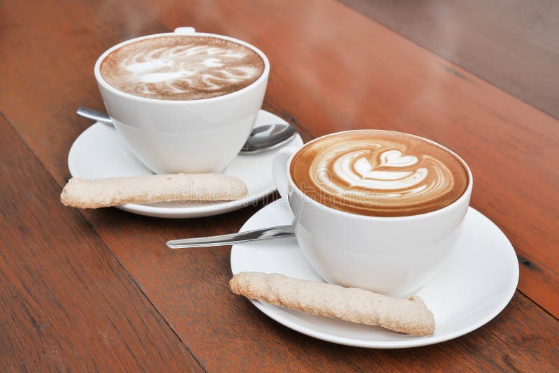 Two cups of latte art coffee